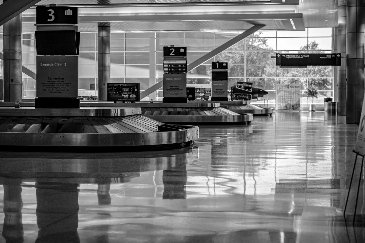 Empty baggage carousel at modern airport terminal